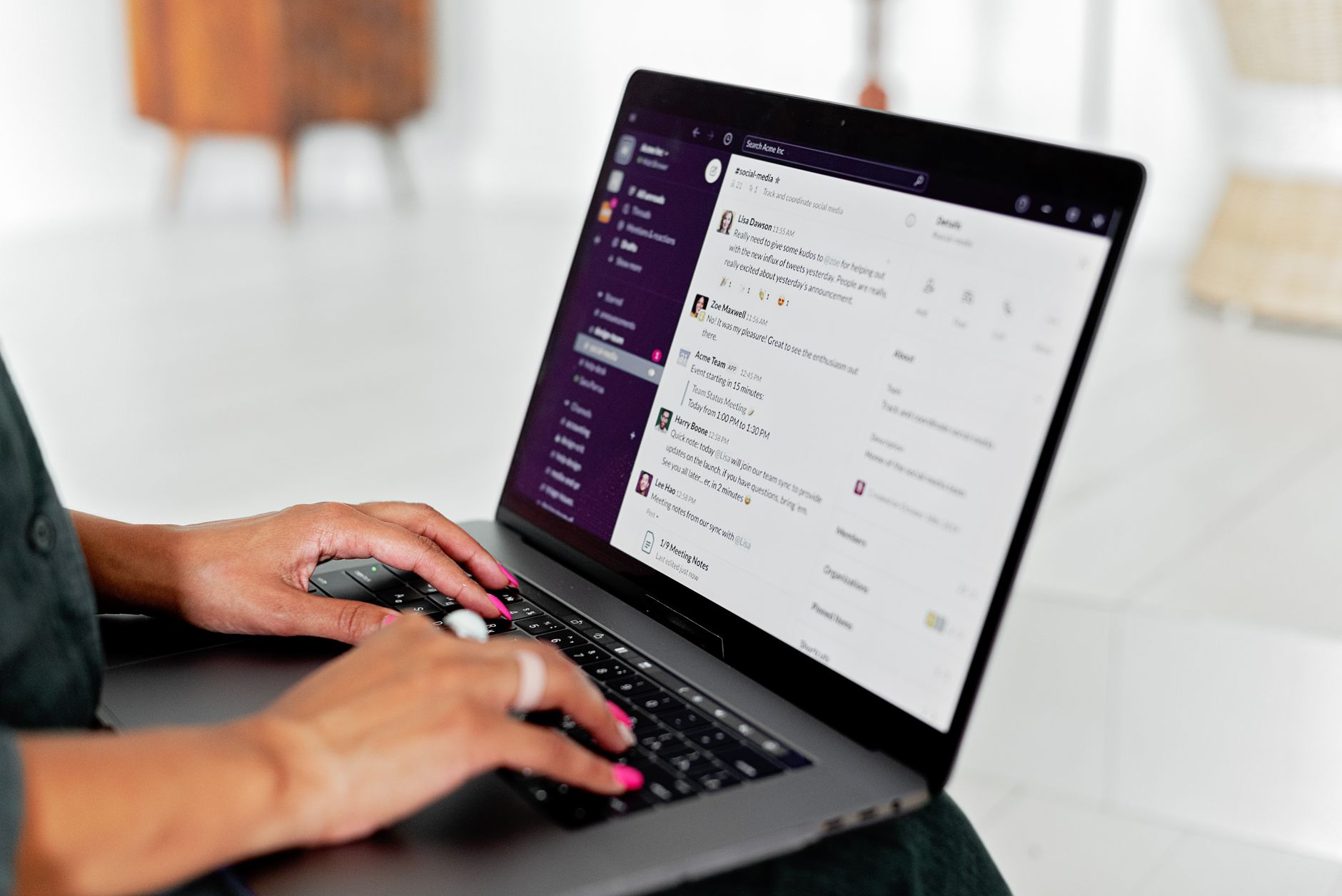 Person comparing two AI chat applications on a laptop at a desk